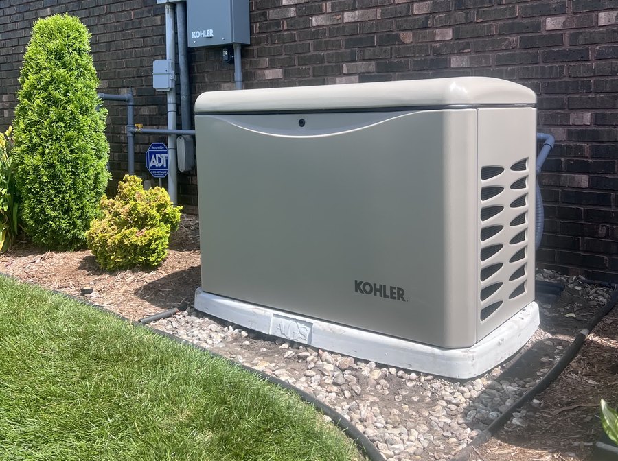 Kohler home standby generator installed by American Generator Solutions beside a brick home in northern Indiana