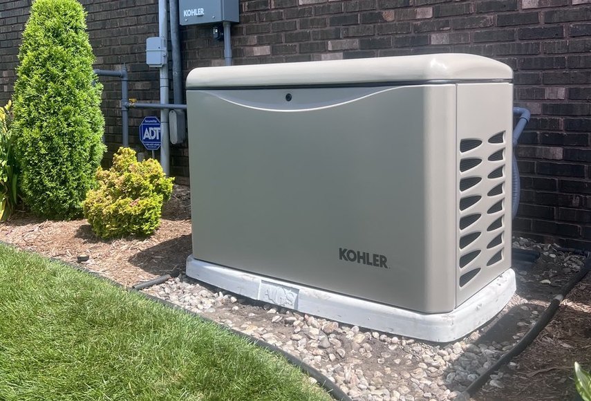 Kohler home standby generator installed beside a brick home in northern Indiana